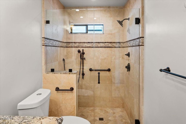 full bath with a stall shower and toilet