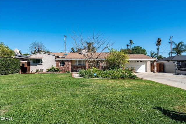 single story home with concrete driveway, a front lawn, an attached garage, and brick siding