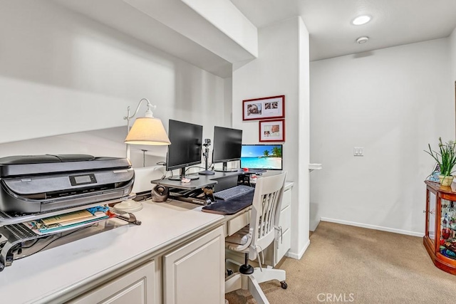 office area with light carpet and baseboards