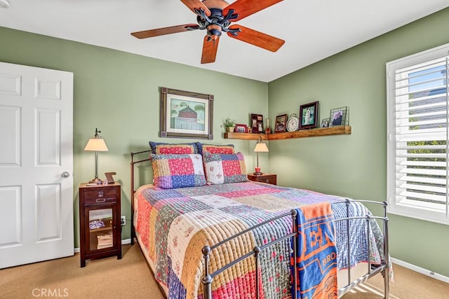 bedroom featuring ceiling fan, carpet flooring, and baseboards