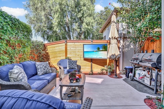 view of patio / terrace with outdoor lounge area, fence, and area for grilling