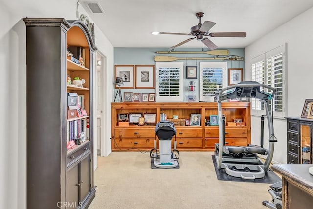 workout area with carpet floors, ceiling fan, and visible vents