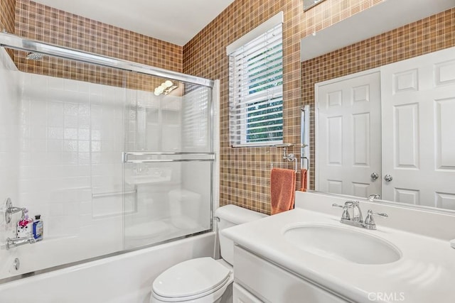 5 Ash Hollow Trl, Ladera Ranch, CA 92694 - bathroom with tile walls, toilet, combined bath / shower with glass door, and vanity
