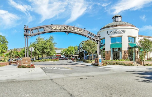 5 Ash Hollow Trl, Ladera Ranch, CA 92694 - view of asphalt street featuring sidewalks, traffic signs, curbs, and street lighting