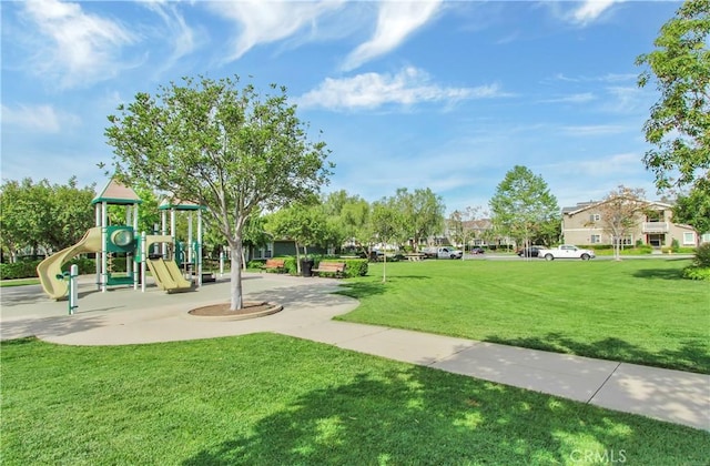 community jungle gym with a lawn