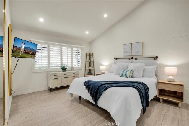 31 Blue River Dr, Palm Desert, CA 92211 - bedroom with light wood finished floors, baseboards, recessed lighting, and lofted ceiling