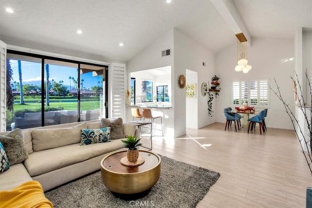 31 Blue River Dr, Palm Desert, CA 92211 - living room with wood finished floors, high vaulted ceiling, recessed lighting, and beam ceiling