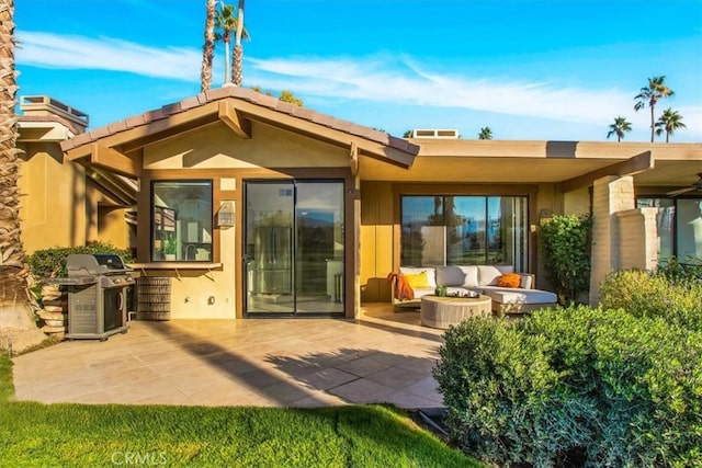 31 Blue River Dr, Palm Desert, CA 92211 - back of house with outdoor lounge area, stucco siding, and a patio