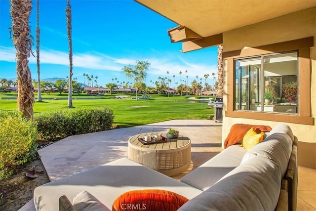 exterior space featuring view of golf course, a grill, and an outdoor hangout area