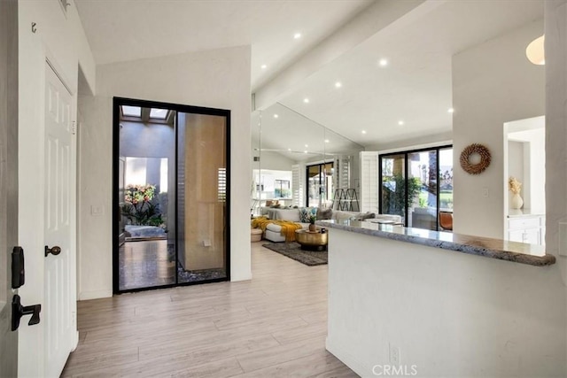 31 Blue River Dr, Palm Desert, CA 92211 - entryway featuring light wood-style floors, beam ceiling, recessed lighting, and high vaulted ceiling