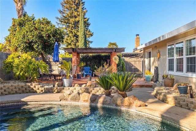 view of pool with a fenced in pool, fence, a pergola, and a patio