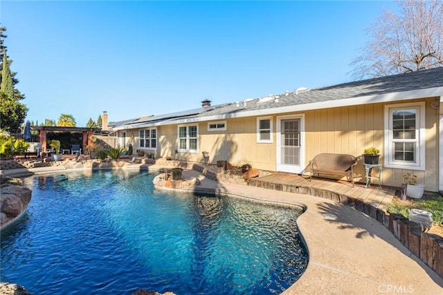 outdoor pool with a patio area