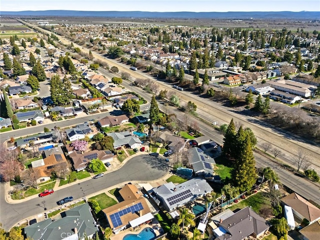 drone / aerial view with a residential view and a mountain view