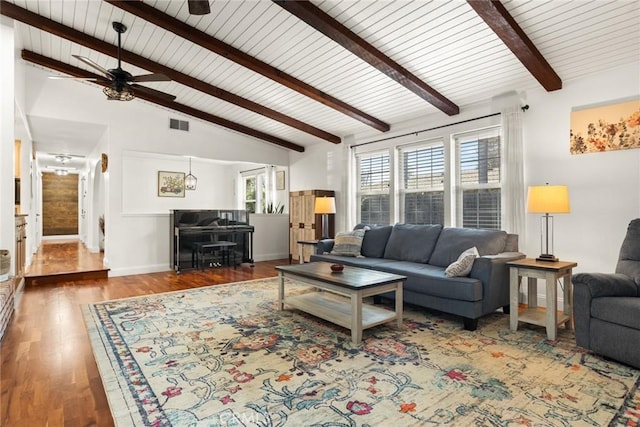 living room with visible vents, lofted ceiling with beams, a ceiling fan, wood finished floors, and baseboards