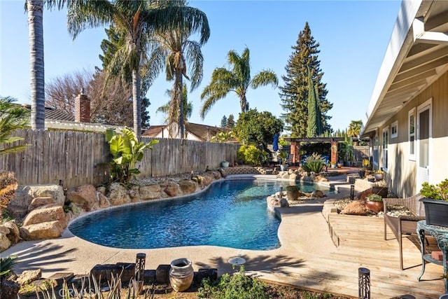 view of swimming pool featuring a fenced backyard, a pergola, a fenced in pool, and a wooden deck