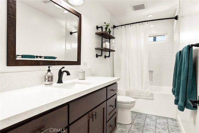 bathroom with shower / bath combo, vanity, and toilet