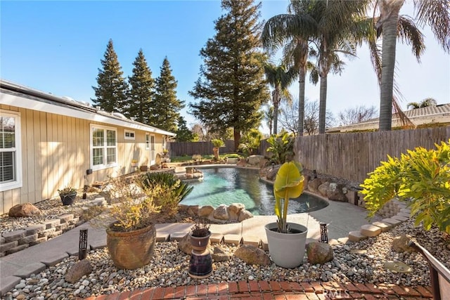 view of swimming pool featuring a fenced in pool and a fenced backyard