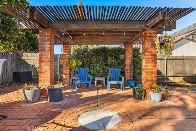 view of patio featuring fence and a pergola