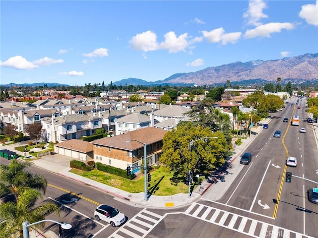 birds eye view of property with a residential view and a mountain view