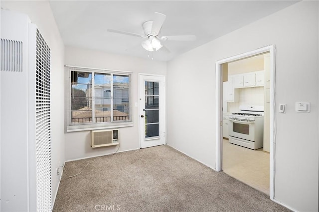 interior space featuring ceiling fan, a heating unit, a wall unit AC, and light colored carpet