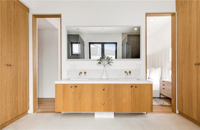 bathroom with double vanity and a sink