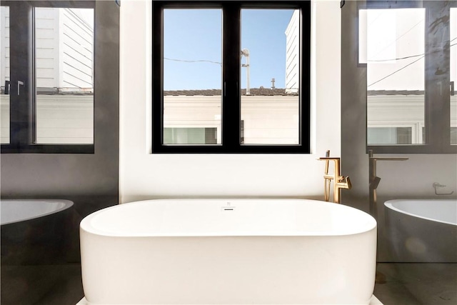 full bathroom with a freestanding tub