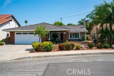 view of front of house with a garage and concrete driveway