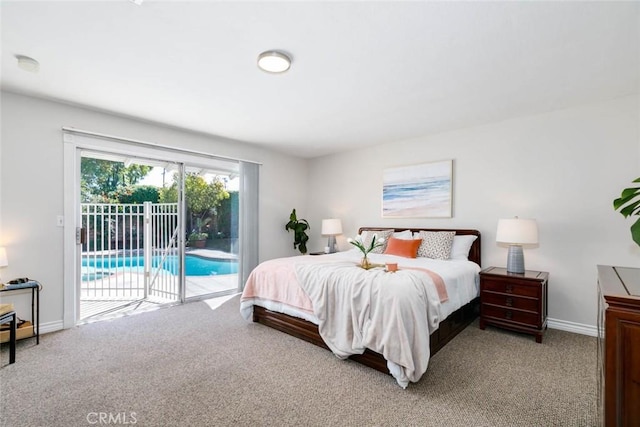 carpeted bedroom featuring access to exterior and baseboards