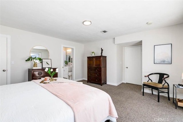 carpeted bedroom featuring visible vents and baseboards