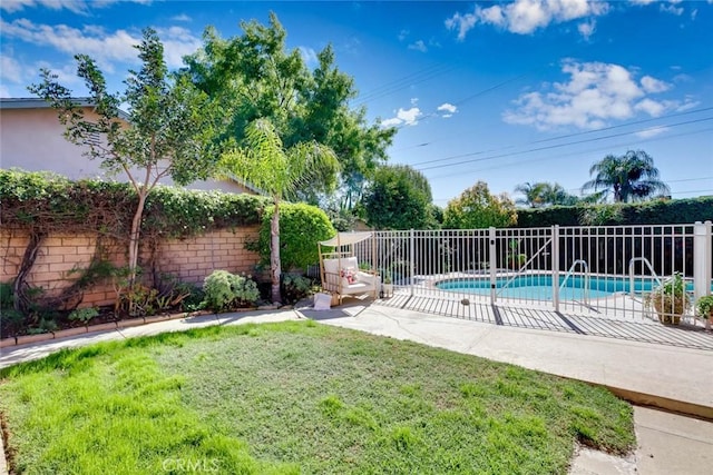 view of pool featuring a fenced in pool, fence, a lawn, and a patio