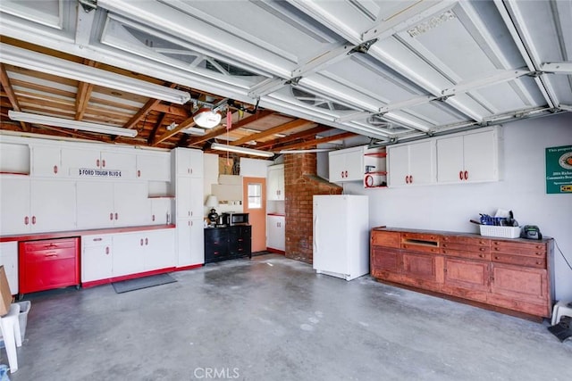 garage with freestanding refrigerator