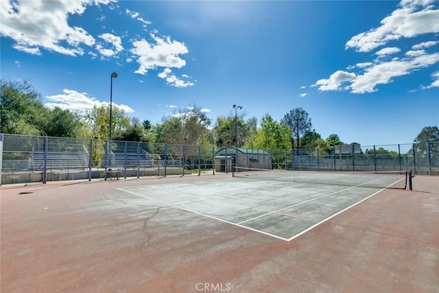 view of tennis court with fence