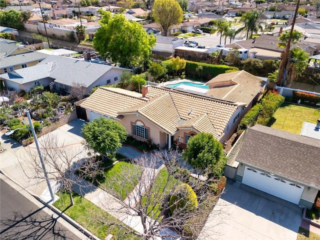 birds eye view of property with a residential view