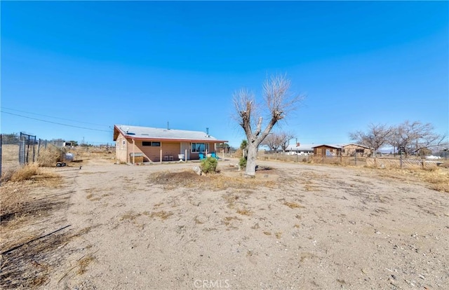 back of property with fence