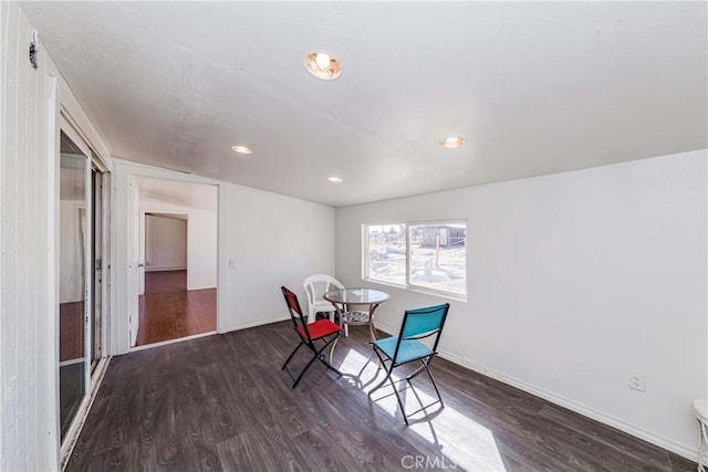 interior space featuring baseboards, wood finished floors, and recessed lighting