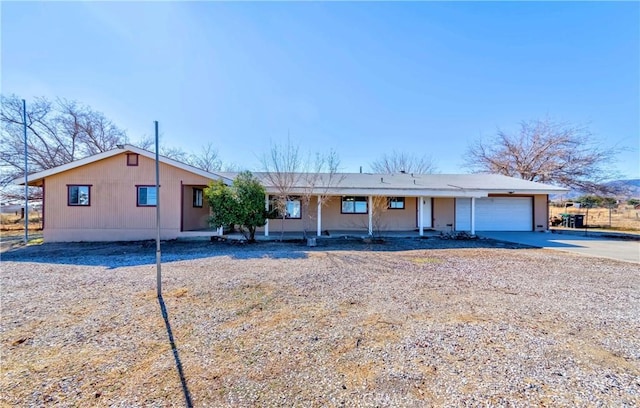 ranch-style home featuring driveway and an attached garage