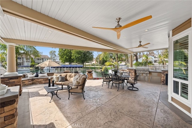 view of patio with an outdoor kitchen, ceiling fan, grilling area, an outdoor living space, and outdoor dining space