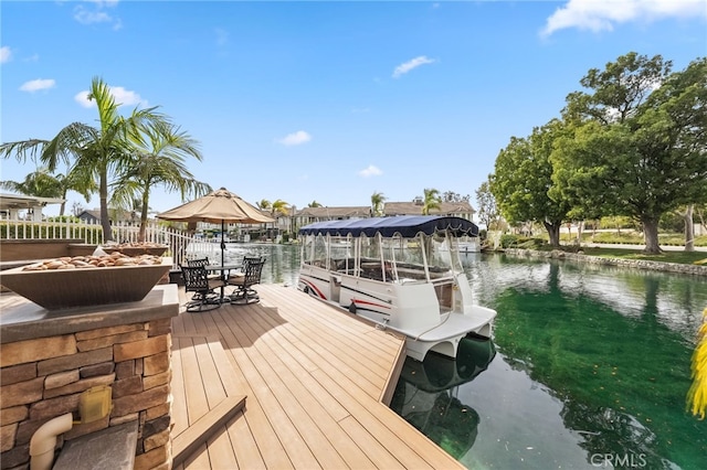 dock area with a water view