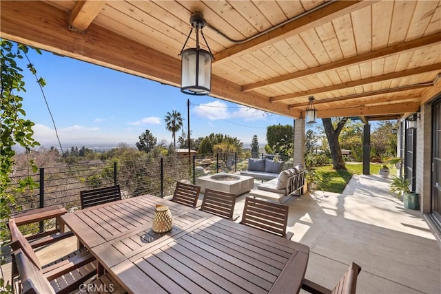 view of patio / terrace with an outdoor living space with a fire pit and outdoor dining space