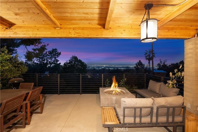 view of patio / terrace featuring an outdoor living space with a fire pit