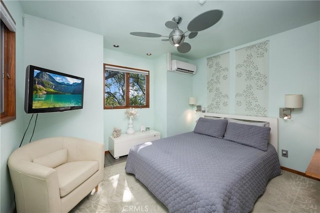 bedroom with ceiling fan, a wall mounted air conditioner, and baseboards