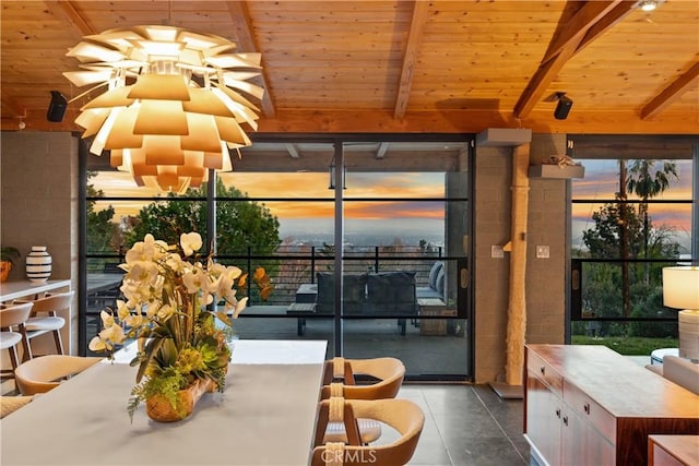 interior space with wood ceiling and lofted ceiling with beams