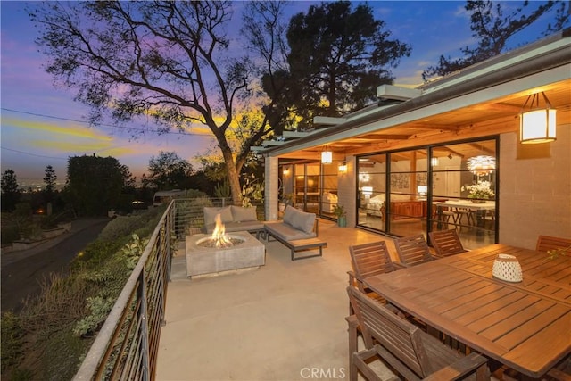 view of patio / terrace featuring a fire pit and outdoor dining space