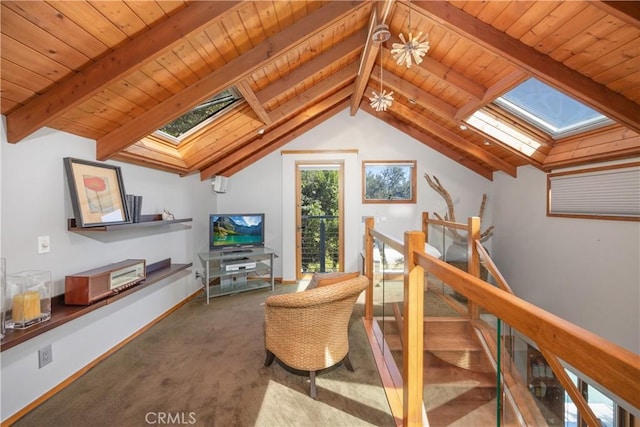 living area with carpet, lofted ceiling with skylight, wood ceiling, an upstairs landing, and baseboards