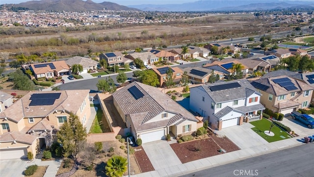 birds eye view of property with a residential view and a mountain view