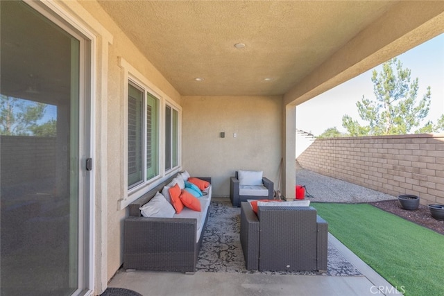 view of patio featuring a fenced backyard and outdoor lounge area