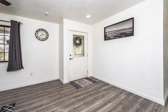 foyer featuring recessed lighting, baseboards, and wood finished floors