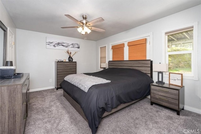 bedroom with carpet floors, a ceiling fan, and baseboards