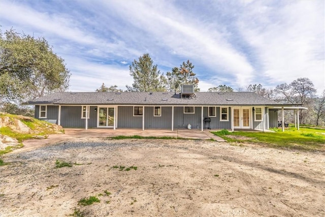 back of house featuring central AC unit, french doors, and a patio area