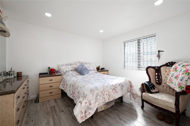 bedroom with wood finished floors and recessed lighting